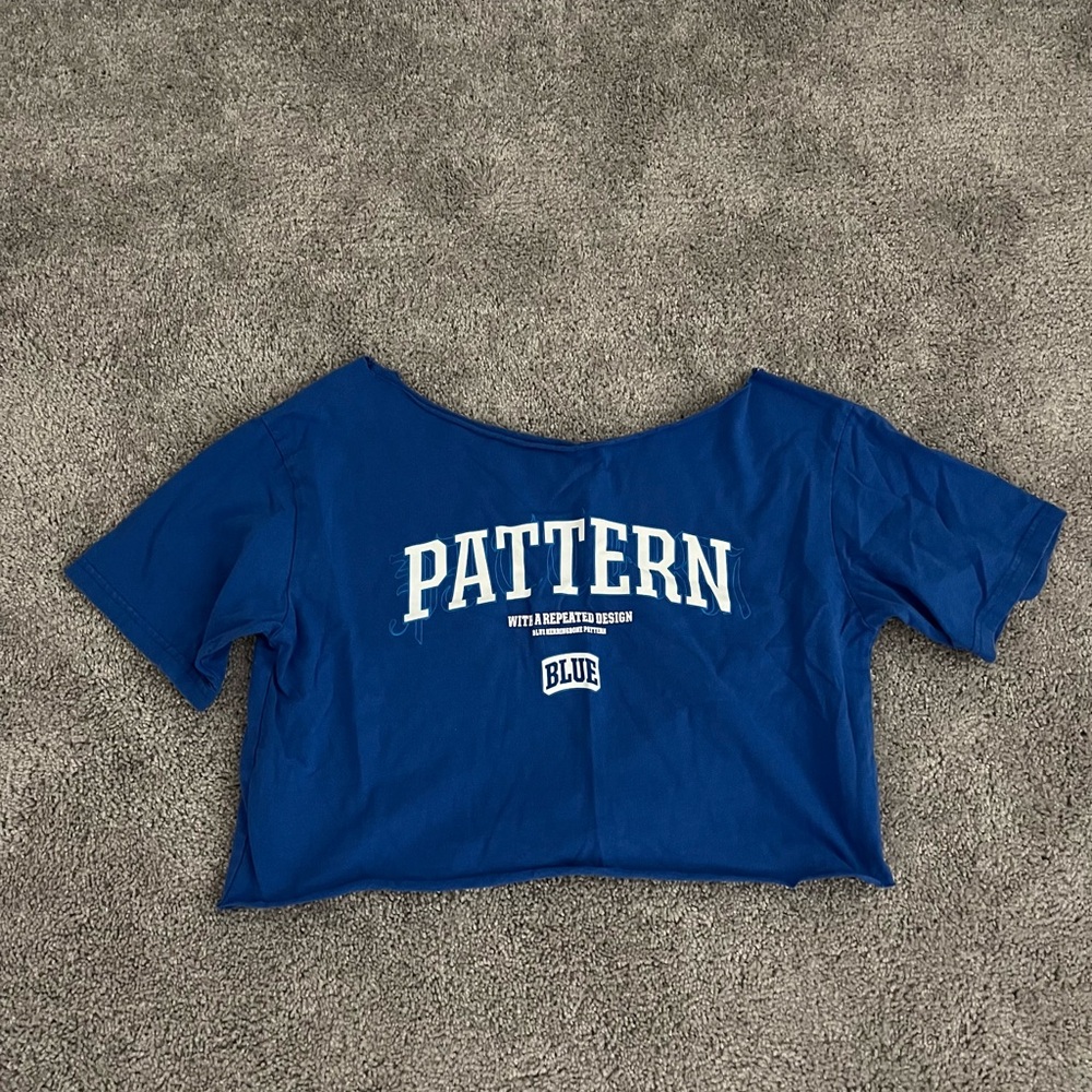 Blue cropped off the shoulder cut tee shirt